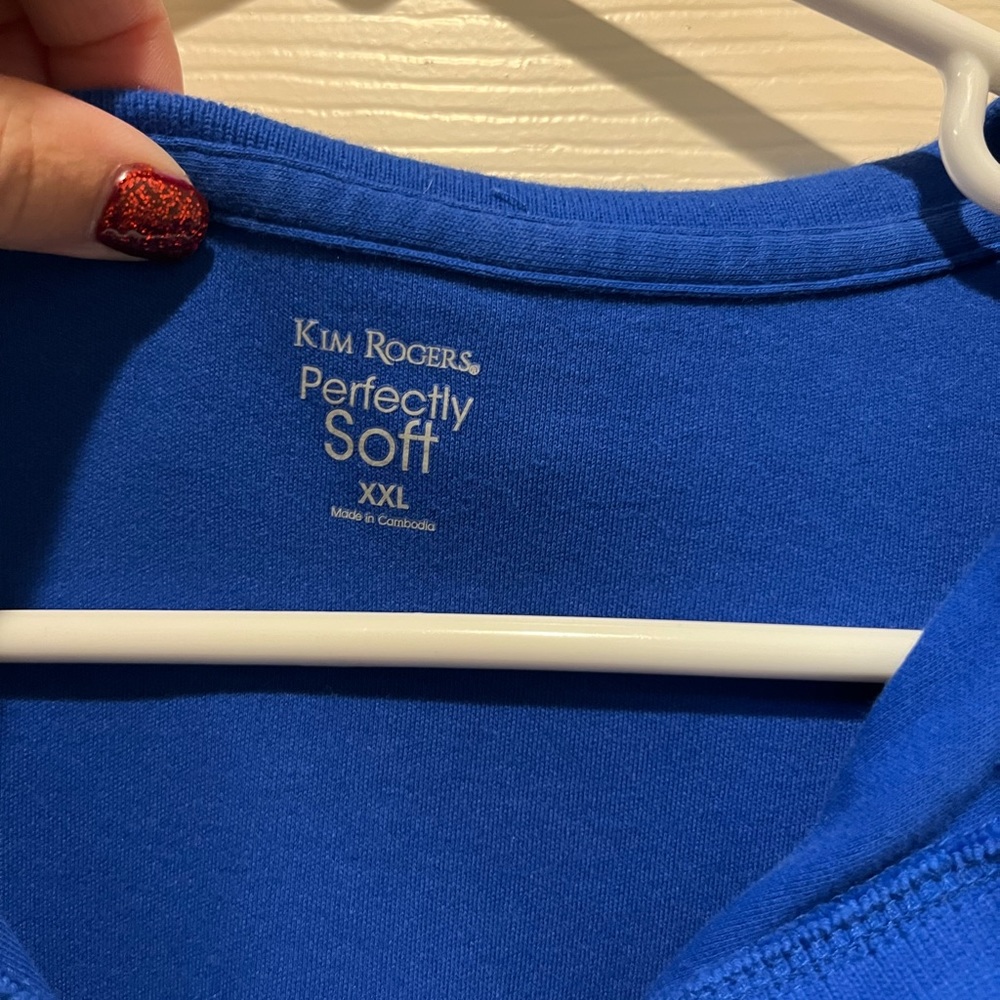 Blue short shelved colored shirt. Good for golf tournaments.